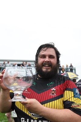 020526 - Llangadog v Cefneithin - Admiral National League 4 West B - Llangadog veteran Telor Dyer celebrates with the trophy at his final game for the Club