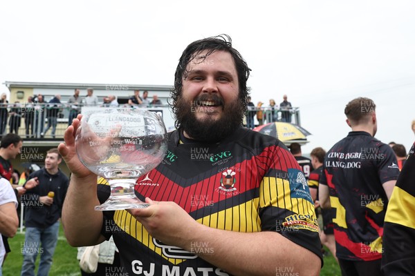 020526 - Llangadog v Cefneithin - Admiral National League 4 West B - Llangadog veteran Telor Dyer celebrates with the trophy at his final game for the Club
