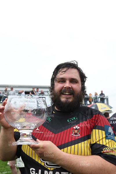 020526 - Llangadog v Cefneithin - Admiral National League 4 West B - Llangadog veteran Telor Dyer celebrates with the trophy at his final game for the Club