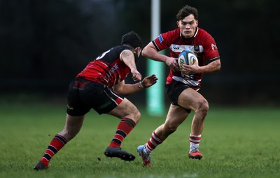 061225 - Llangennech v Brecon - WRU Premiership - Huw Jones of Brecon is tackled by Wil Thomas of Llangennech 