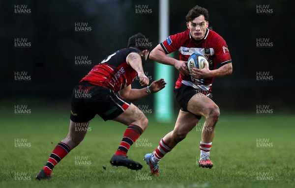 061225 - Llangennech v Brecon - WRU Premiership - Huw Jones of Brecon is tackled by Wil Thomas of Llangennech 
