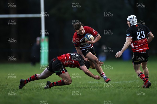 061225 - Llangennech v Brecon - WRU Premiership - Huw Jones of Brecon is tackled by Wil Thomas of Llangennech 