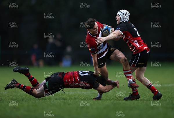 061225 - Llangennech v Brecon - WRU Premiership - Huw Jones of Brecon is tackled by Wil Thomas of Llangennech 