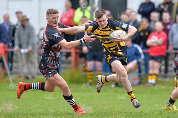 290417 Llangennech v Kidwelly - WRU National League 1 West - Liam Jones of Kidwelly hands off Gareth Rees of Llangennch