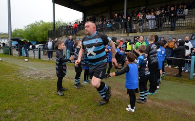 300424 - Llanharan v Gilfach Goch - National League Division 2 East Central - Players of Llanharan walking out of the tunnel