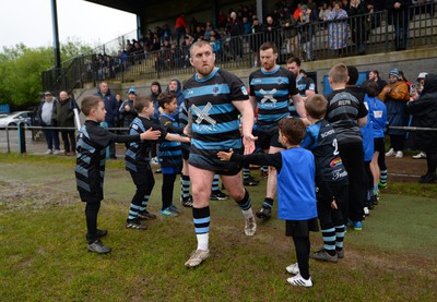 300424 - Llanharan v Gilfach Goch - National League Division 2 East Central - Players of Llanharan walking out of the tunnel