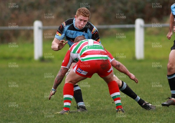 141213 Llanharan RFC v Ebbw Vale RFC - Swalec Premier League -Matthew Williams of Llanharan takes on Ronny Kynes of Ebbw Vale 