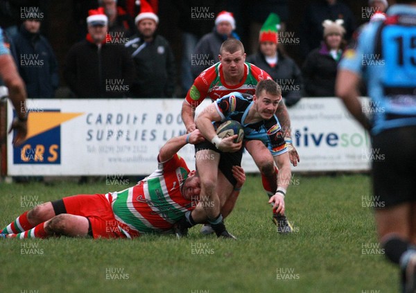 141213 Llanharan RFC v Ebbw Vale RFC - Swalec Premier League -Jonathan Lewis  of Llanharan is tackled by Robert Sevenoaks of Ebbw Vale