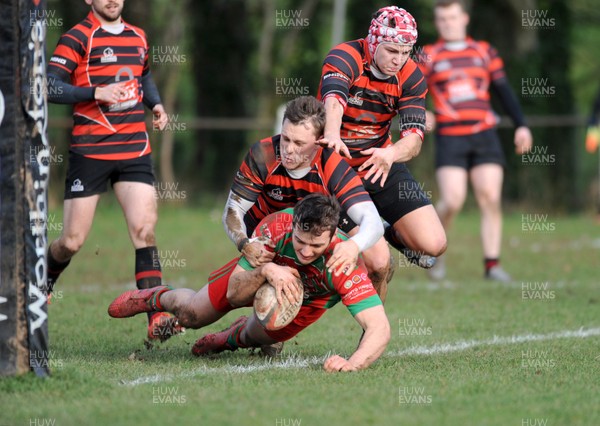 140117 - Llanishen v Pwllheli - WRU National Plate -  Ianto Parry of Pwllheli avoids avoids the tackle of Miles Anderson of Llanishen to score a try