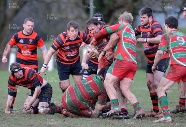 140117 - Llanishen v Pwllheli - WRU National Plate -  Lee Swindlehurst of Llanishen is tackled by Kevin Morris of Pwllheli