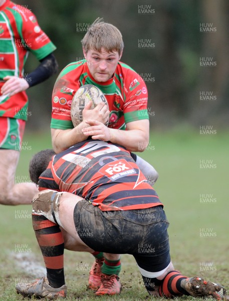 140117 - Llanishen v Pwllheli - WRU National Plate -  Dafydd Anwyl Williams of Pwllheli is tackled by Miles Anderson of Llanishen