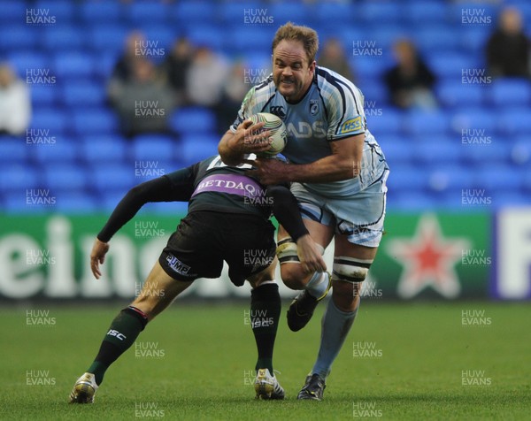 14.01.12 - London Irish v Cardiff Blues - Heineken Cup - Xavier Rush of Cardiff Blues is tackled by Adrian Jarvis of London Irish. 