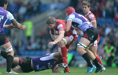 230813 - London Welsh v Scarlets - Preseason Friendly -Richard Kelly of Scarlets is tackled by Nathan Morris and Peter Browne of London Welsh