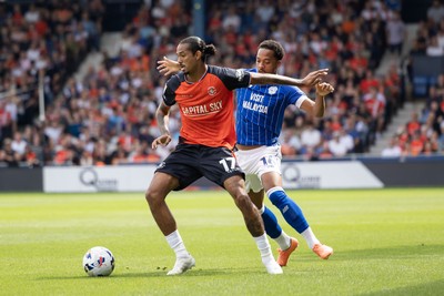 230825 - Luton Town v Cardiff City - Sky Bet League 1 - Luton Town’s Nigel Lonwijk and Cardiff City’s Chris Wilcock
