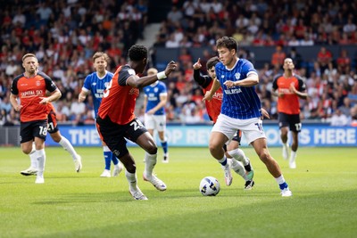 230825 - Luton Town v Cardiff City - Sky Bet League 1 - Cardiff City’s Rubin Colwill and Luton Town’s Christ Makosso