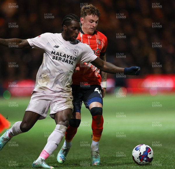 310123 - Luton Town v Cardiff City, EFL Sky Bet Championship - Sheyi Ojo of Cardiff City holds off Alfie Doughty of Luton Town