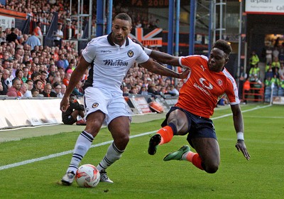 160816 - Luton Town vs Newport County - SKY Bet League 2 -Pelly Ruddock of Luton puts in a flying tackle on Newport's Jamie Turley