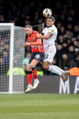 040323 - Luton Town v Swansea City - Sky Bet Championship - Joel Latibeaudiere of Swansea City heads the ball