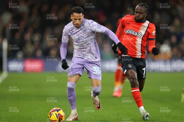 071224 Luton Town v Swansea City, EFL Sky Bet Championship - Ronald of Swansea City and Victor Moses of Luton Town compete for the ball