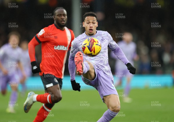 071224 Luton Town v Swansea City, EFL Sky Bet Championship - Ronald of Swansea City controls the ball as Amari'i Bell of Luton Town closes in