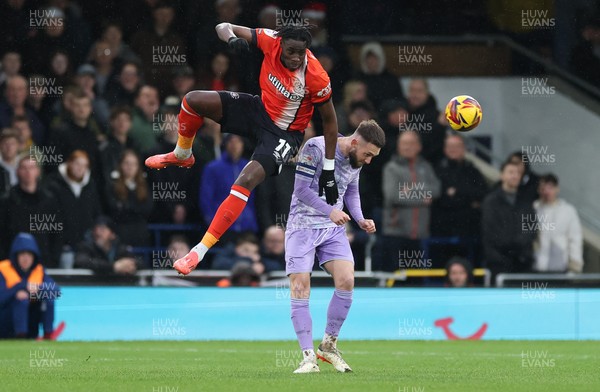 071224 Luton Town v Swansea City, EFL Sky Bet Championship - Elijah Adebayo of Luton Town gets above Matt Grimes of Swansea City