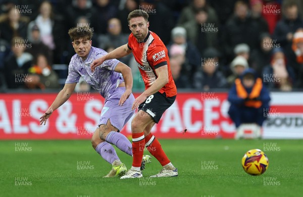 071224 Luton Town v Swansea City, EFL Sky Bet Championship - Goncalo Franco of Swansea City and Jordan Clark of Luton Town compete for the ball