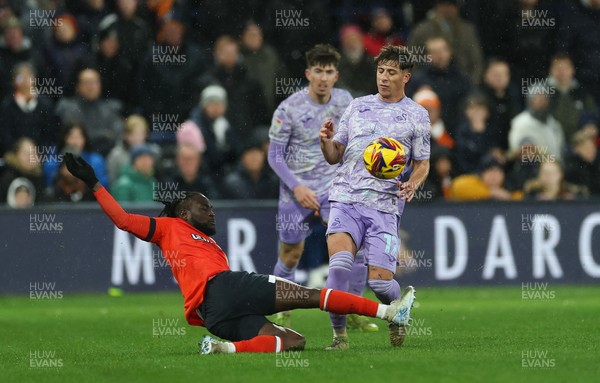 071224 Luton Town v Swansea City, EFL Sky Bet Championship - Goncalo Franco of Swansea City is tackled by Victor Moses of Luton Town