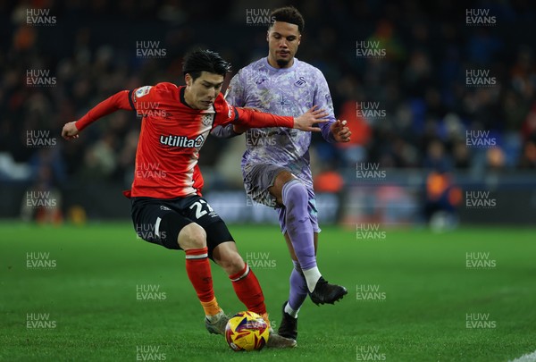 071224 Luton Town v Swansea City, EFL Sky Bet Championship - Daiki Hashioka of Luton Town and Myles Peart-Harris of Swansea City compete for the ball