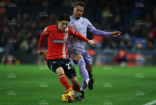 071224 Luton Town v Swansea City, EFL Sky Bet Championship - Daiki Hashioka of Luton Town and Myles Peart-Harris of Swansea City compete for the ball