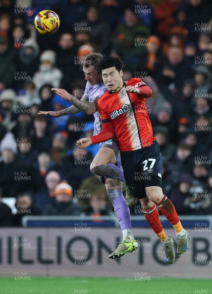 071224 Luton Town v Swansea City, EFL Sky Bet Championship - Josh Tymon of Swansea City and Daiki Hashioka of Luton Town compete for the ball