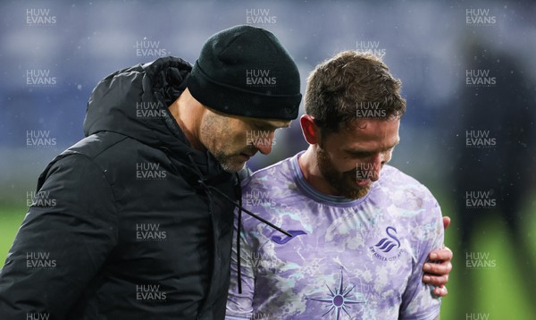 071224 Luton Town v Swansea City, EFL Sky Bet Championship - Swansea City head coach Luke Williams with Joe Allen of Swansea City at the end of the match