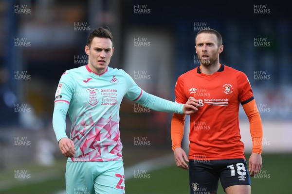 130321 - Luton Town v Swansea City - Sky Bet Championship - Connor Roberts of Swansea City with Jordan Clark of Luton Town
