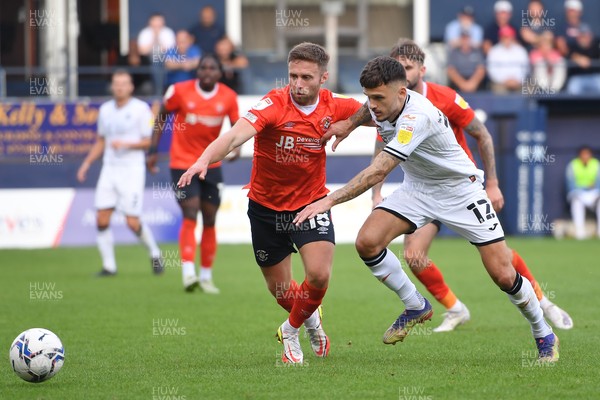 180921 - Luton Town v Swansea City - Sky Bet Championship - Jamie Paterson of Swansea City  battles for possession with Jordan Clark of Luton Town