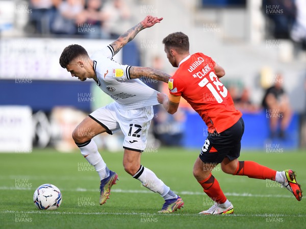 180921 - Luton Town v Swansea City - Sky Bet Championship - Jamie Paterson of Swansea City is fouled by Jordan Clark of Luton Town