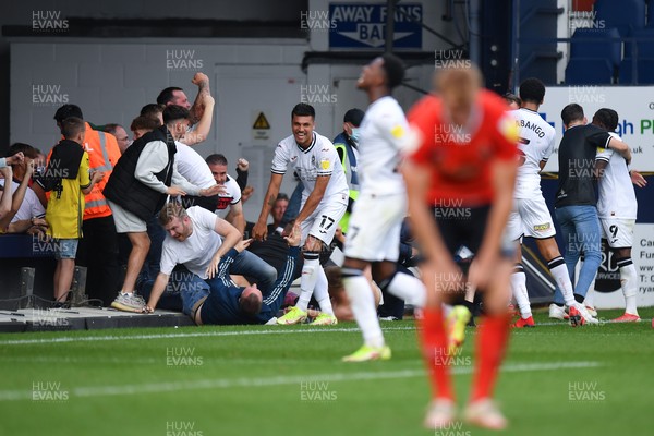 180921 - Luton Town v Swansea City - Sky Bet Championship - Joel Piroe (17) of Swansea City celebrates scoring his side's third goal in injury time as fans get onto the pitch