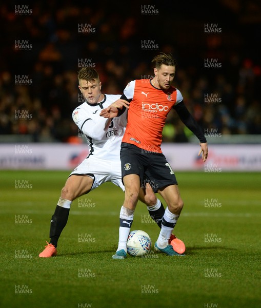 211219 - Luton Town v Swansea City - Sky Bet Championship -  Jake Bidwell of Swansea challenges for the ball