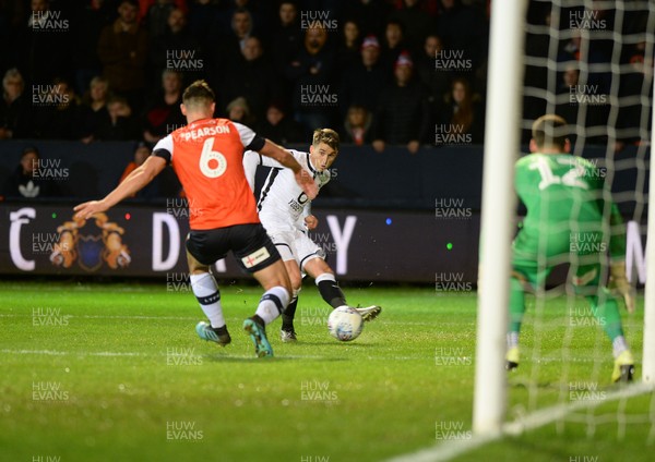 211219 - Luton Town v Swansea City - Sky Bet Championship -  Tom Carroll gets a shot in for Swansea