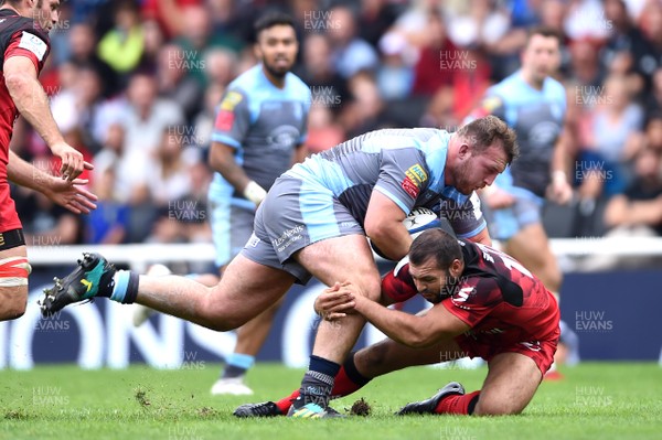 141018 - Lyon v Cardiff Blues - European Rugby Champions Cup - Dillon Lewis of Cardiff Blues is tackled by Thibaut Regard of Lyon