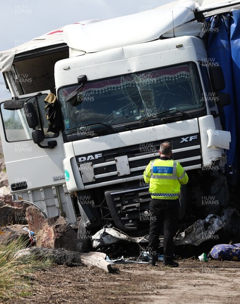 040919 - Prince of Wales Bridge Crash - A police officer examines the cab of the lorry involved in this morning's crash on the M4 at The Prince of Wales bridge