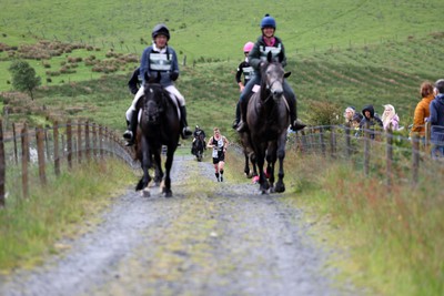 110622 - Whole Earth Man v Horse Race - Competitors take part in the Whole Earth Man v Horse race in Llanwrtyd Wells, Wales Running for over 40 years, Man v Horse is an epic 225-mile challenge which pits humans against horses across a multi-terrain course It is being staged for the first time after a two year absence due to the Covid Pandemic