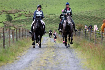 110622 - Whole Earth Man v Horse Race - Competitors take part in the Whole Earth Man v Horse race in Llanwrtyd Wells, Wales Running for over 40 years, Man v Horse is an epic 225-mile challenge which pits humans against horses across a multi-terrain course It is being staged for the first time after a two year absence due to the Covid Pandemic