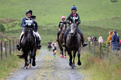 110622 - Whole Earth Man v Horse Race - Competitors take part in the Whole Earth Man v Horse race in Llanwrtyd Wells, Wales Running for over 40 years, Man v Horse is an epic 225-mile challenge which pits humans against horses across a multi-terrain course It is being staged for the first time after a two year absence due to the Covid Pandemic