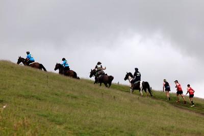 110622 - Whole Earth Man v Horse Race - Competitors take part in the Whole Earth Man v Horse race in Llanwrtyd Wells, Wales Running for over 40 years, Man v Horse is an epic 225-mile challenge which pits humans against horses across a multi-terrain course It is being staged for the first time after a two year absence due to the Covid Pandemic