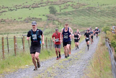 110622 - Whole Earth Man v Horse Race - Competitors take part in the Whole Earth Man v Horse race in Llanwrtyd Wells, Wales Running for over 40 years, Man v Horse is an epic 225-mile challenge which pits humans against horses across a multi-terrain course It is being staged for the first time after a two year absence due to the Covid Pandemic