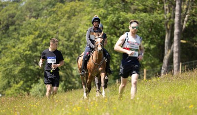 130626 - Man v Horse, Llanwrytd Wells - Competitors make their way around the course during the annual Man v Horse Race held at Llanwrytd Well, Powys, Wales