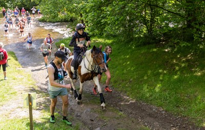 130626 - Man v Horse, Llanwrytd Wells - Competitors make their way around the course during the annual Man v Horse Race held at Llanwrytd Well, Powys, Wales