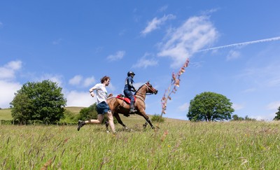 130626 - Man v Horse, Llanwrytd Wells - Competitors make their way around the course during the annual Man v Horse Race held at Llanwrytd Well, Powys, Wales