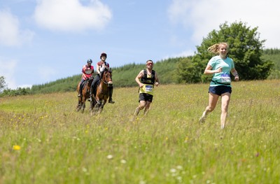 130626 - Man v Horse, Llanwrytd Wells - Competitors make their way around the course during the annual Man v Horse Race held at Llanwrytd Well, Powys, Wales