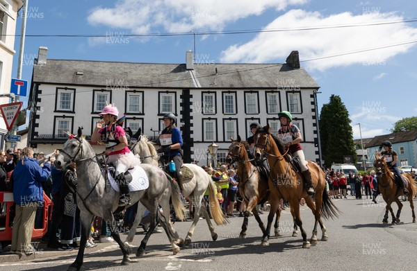 130626 - Man v Horse, Llanwrytd Wells - Riders and their horses set off at the start of  the annual Man v Horse Race held at Llanwrytd Well, Powys, Wales