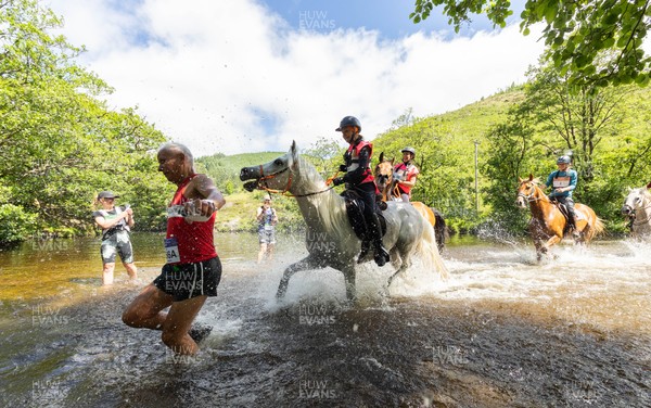130626 - Man v Horse, Llanwrytd Wells - Competitors make their way around the course during the annual Man v Horse Race held at Llanwrytd Well, Powys, Wales